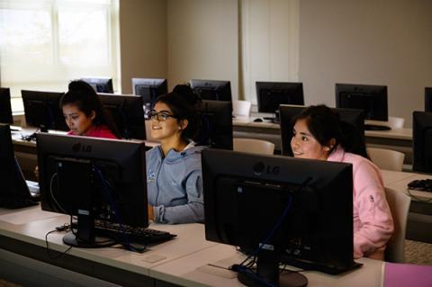 Students work on computers at BMCC Workforce Training Center